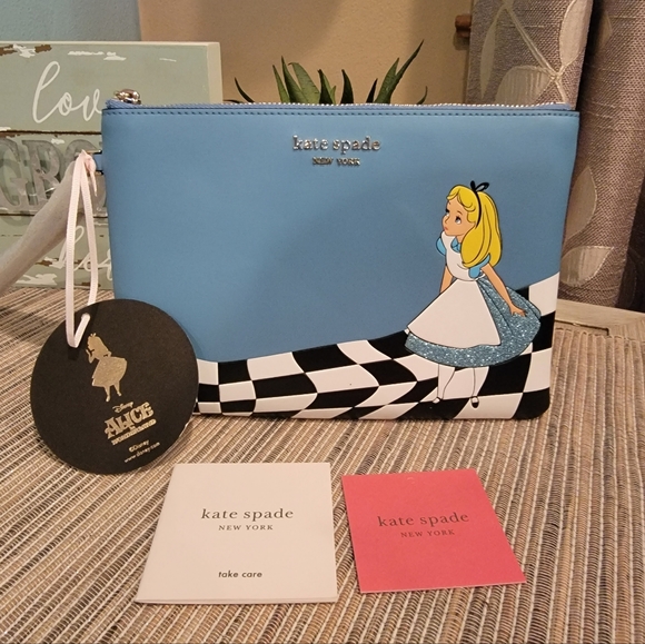 kate spade Handbags - Kate Spade Disney X Alice wristlet